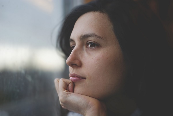 A woman looking out of a window